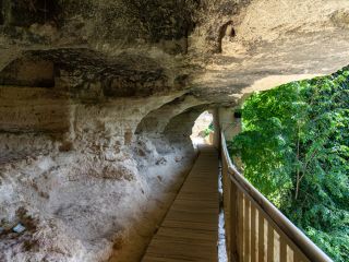 A Bridge Going Through A Cave